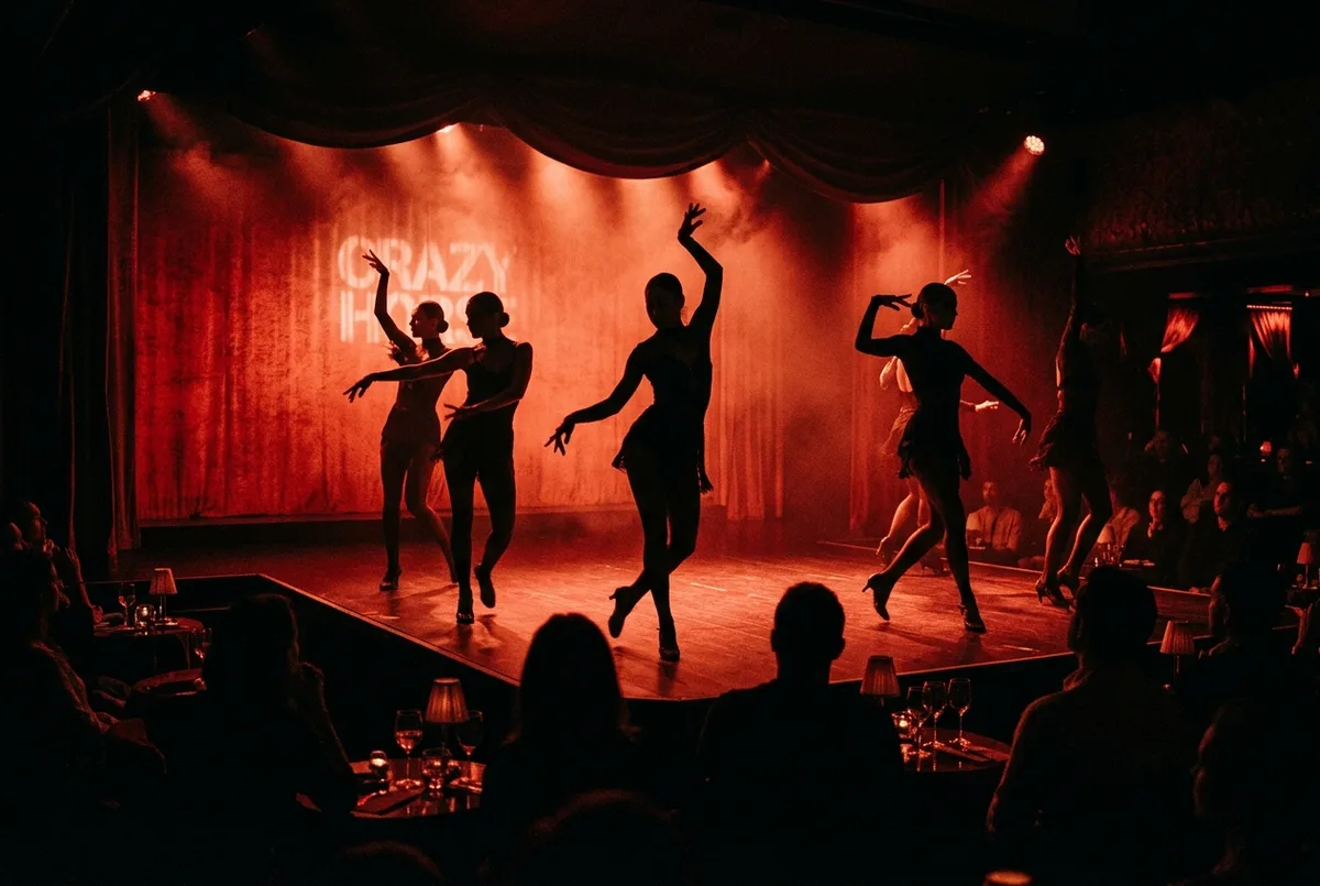 Moody red-lit cabaret stage with silhouetted dancers in dramatic lighting at the Crazy Horse Paris, artistic shadow choreography, crazy horse paris cabaret evening atmosphere